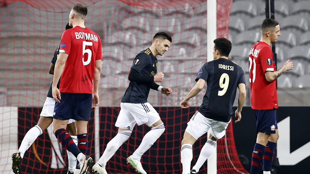 Dusan Tadic of Ajax, Oussama Idrissi or Ajax celebrate the 1-1 during the UEFA Europa League match between Lille OSC and Ajax Amsterdam at the Pierre Mauroy Stadium on February 18, 2021