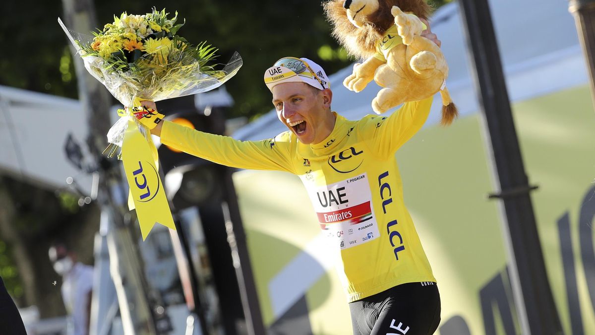 Race winner's Yellow Jersey Tadej Pogacar of Slovenia and UAE Team Emirates celebrates during the trophy ceremony of final stage 21 of the 108th Tour de France 2021, a flat stage of 108,4 km stage from Chatou to Paris Champs-Elysees