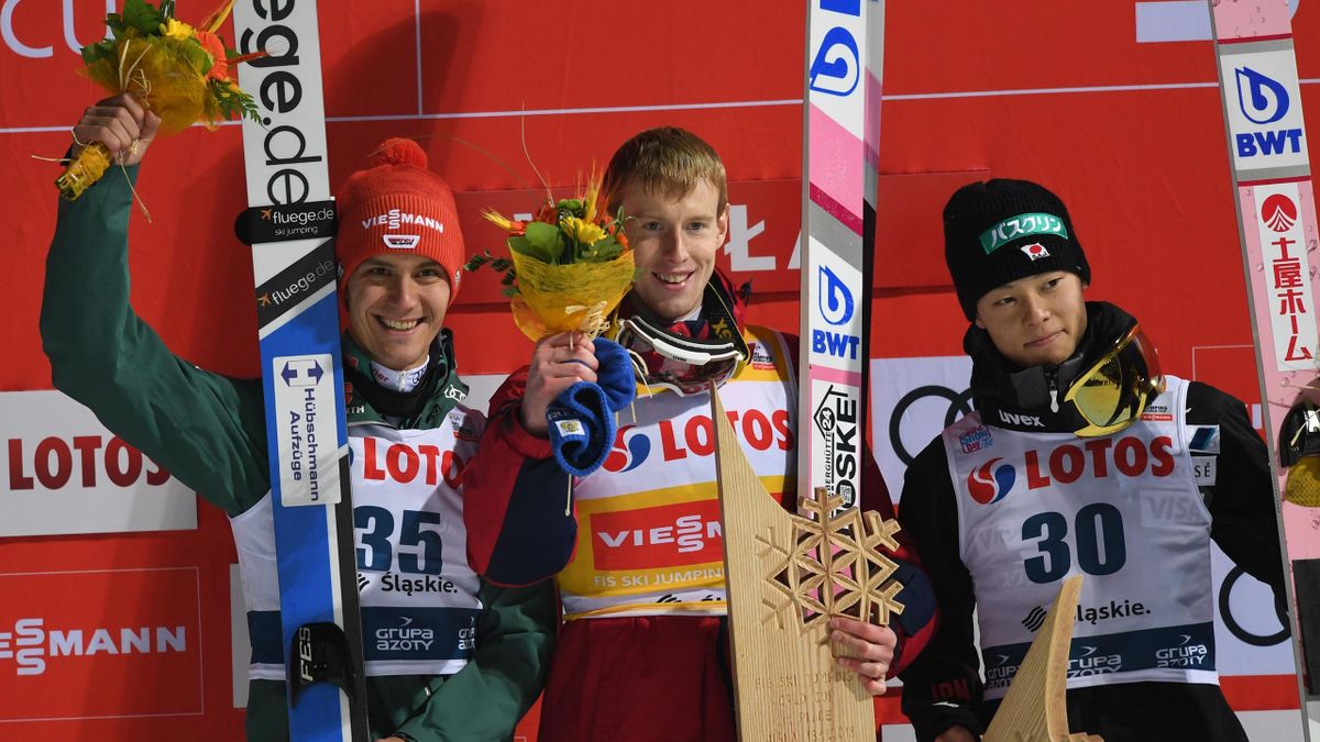Germany's Stephan Leyhe, Russia's Evgeniy Klimov and Japan's Ryoyu Kobayashi celebrates on the podium after the the FIS Ski Jumping World Cup in Wisla