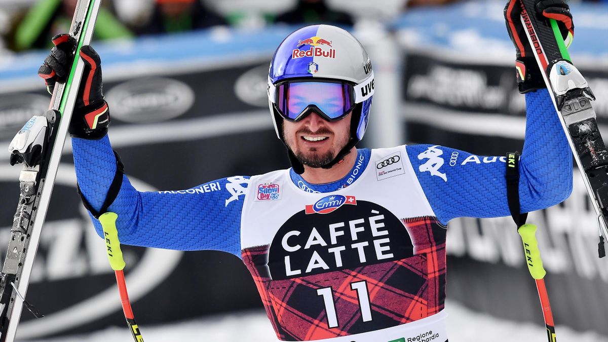 Italy's Dominik Paris celebrates after crossing the finish line to win the FIS Alpine World Cup Men Downhill in Bormio