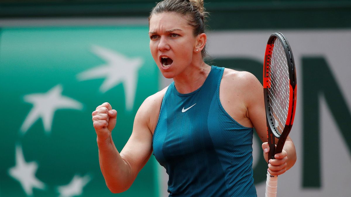 Romania's Simona Halep reacts during her first round match against Alison Riske of the U.S.