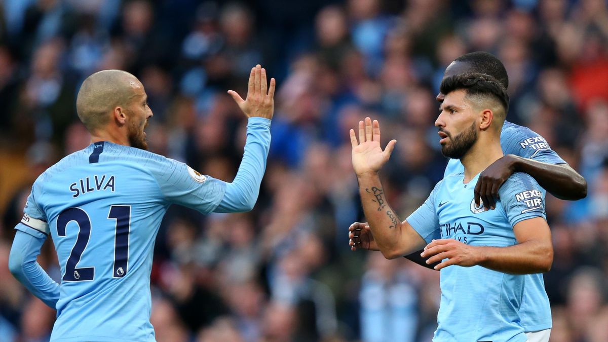 David Silva of Manchester City and Sergio Aguero of Manchester City celebrate after teammate Raheem Sterling scores their team's fourth goal during the Premier League match between Manchester City and Southampton FC at Etihad Stadium on November 4, 2018 i