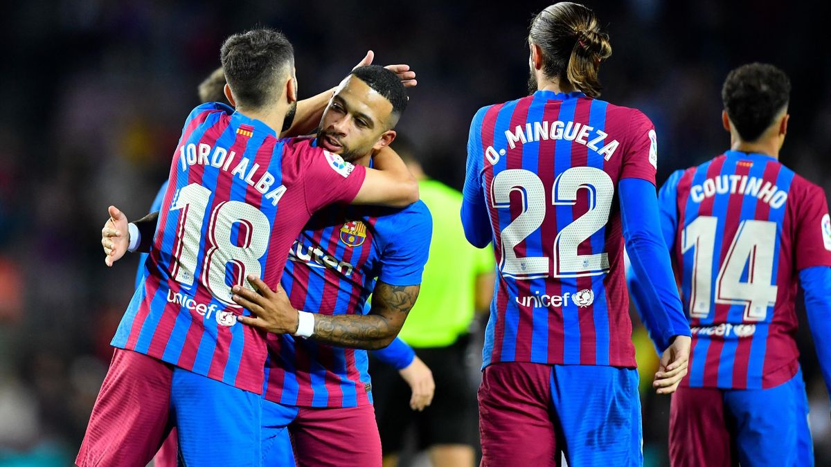 Barcelona's Spanish defender Jordi Alba congratulates Barcelona's Dutch forward Memphis Depay for scoring the opening goal during the Spanish League football match between FC Barcelona and Deportivo Alaves at the Camp Nou stadium in Barcelona