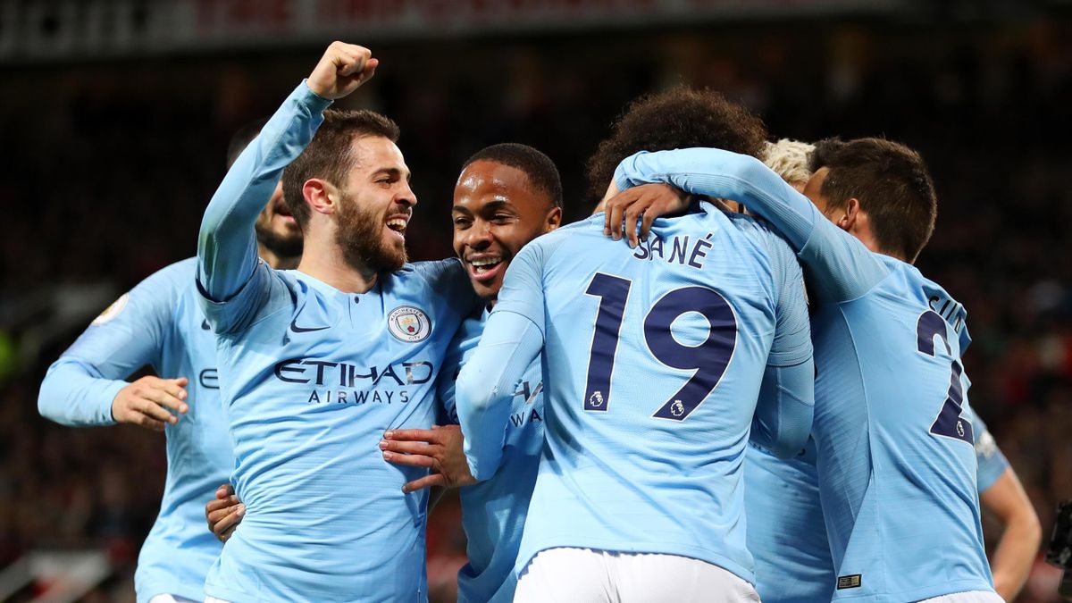 Leroy Sane of Manchester City celebrates with teammates David Silva, Bernardo Silva, Sergio Aguero and Raheem Sterling after scoring his team's second goal during the Premier League match between Manchester United and Manchester City at Old Trafford on A