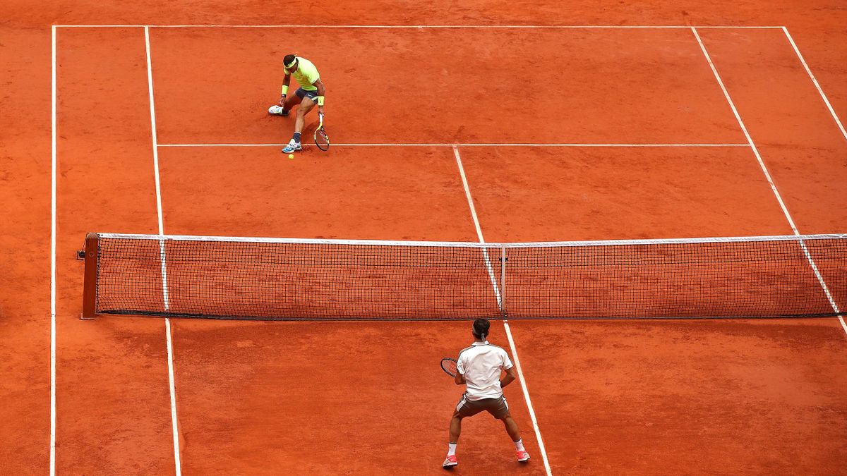 PARIS, FRANCE - JUNE 07: Rafael Nadal of Spain returns the ball during his mens singles semi-final match against Roger Federer of Switzerland during Day thirteen of the 2019 French Open at Roland Garros on June 07, 2019 in Paris, France