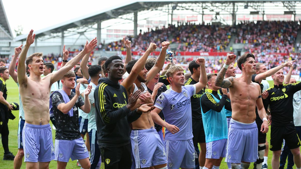 Leeds players and staff celebrate in front of their fans after the Premier League match between Brentford and Leeds United at Brentford Community Stadium on May 22, 2022 in Brentford, United Kingdom.
