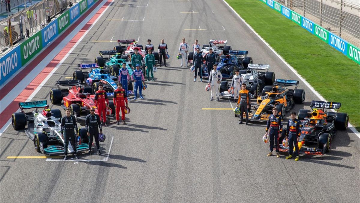 The F1 drivers pose for a photo on the grid with their cars during Day One of F1 Testing at Bahrain International Circuit on March 10, 2022 in Bahrain