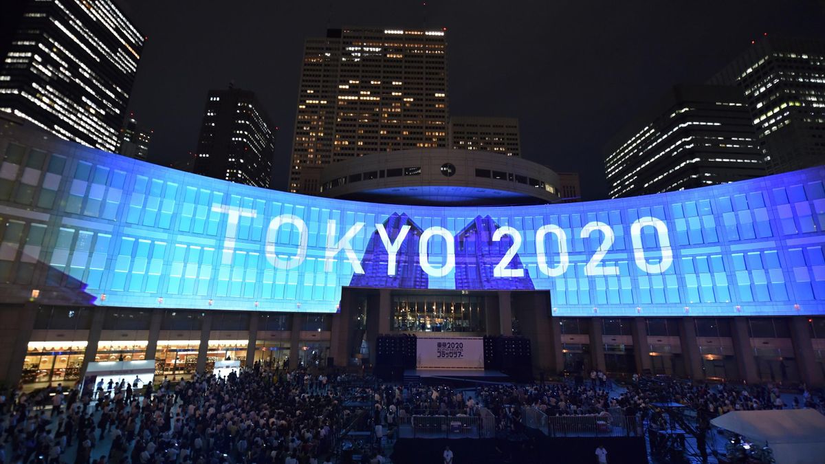 A projection that reads "Tokyo 2020" is seen during a ceremony marking three years to go before the start of the Tokyo 2020 Olympic games at the Tokyo Metropolitan Assembly Building on July 24, 2017