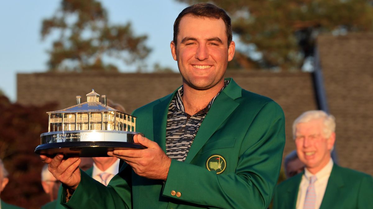 Scottie Scheffler poses with the Masters trophy during the Green Jacket Ceremony after winning the Masters at Augusta National Golf Club on April 10, 2022 in Augusta, Georgia.