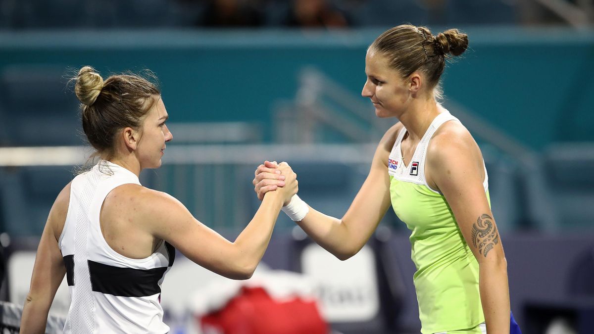 Karolina Pliskova of Czech Republic is congratulated by Simona Halep of Romania after their match during day eleven of the Miami Open tennis on March 28, 2019 in Miami Gardens, Florida