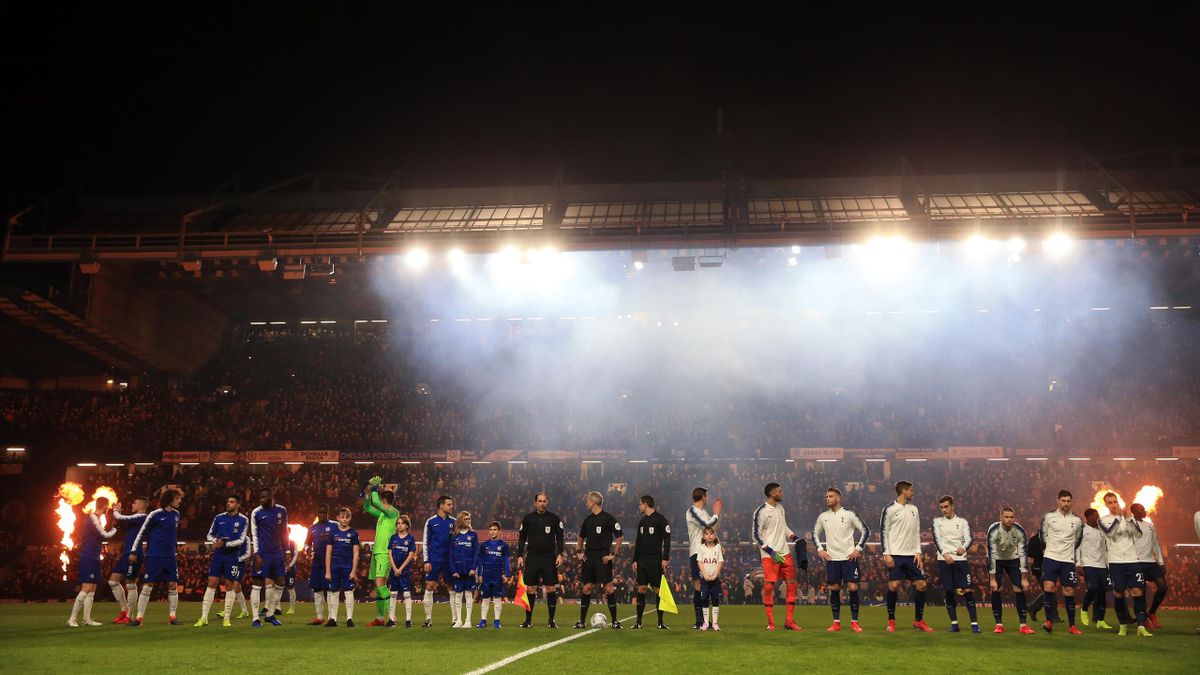 ONDON, ENGLAND - JANUARY 24: The players line up under a blanket of smoke before kick off during the Carabao Cup Semi-Final