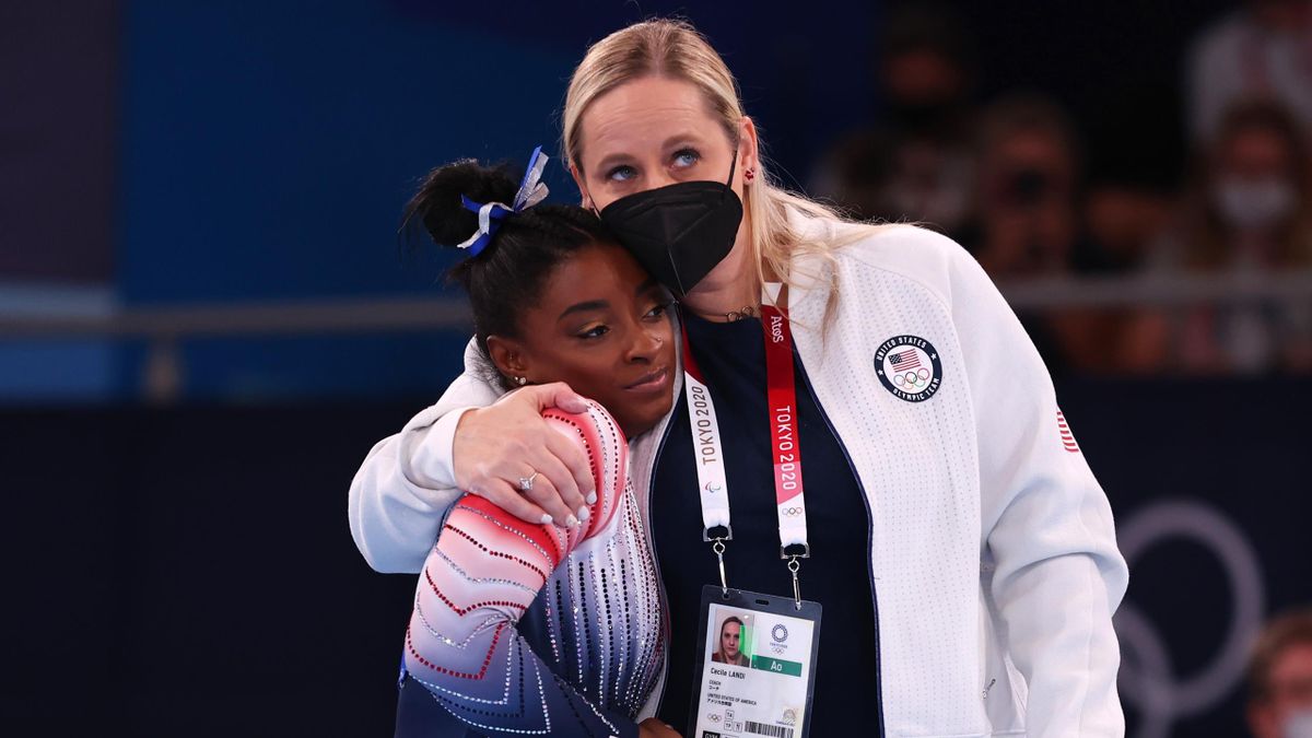Simone Biles of Team United States and coach Cecile Canqueteau-Landi interact during the Women's Balance Beam Final on day eleven of the Tokyo 2020 Olympic Games at Ariake Gymnastics Centre