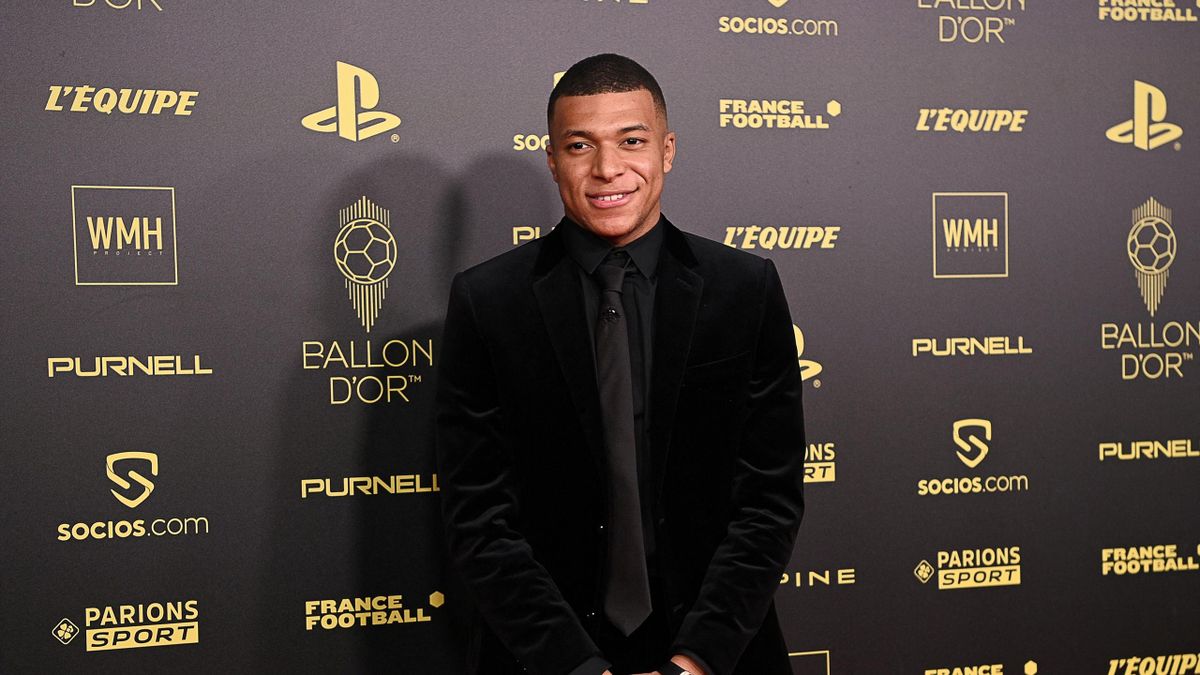 Kylian Mbappe poses upon arrival to attend the 2021 Ballon d'Or