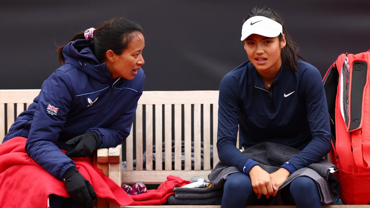 Emma Raducanu of Great Britain speaks with Anne Keothavong, Team Captain of Great Britain during day two of the Billie Jean King Cup Play-Off match between the Czech Republic and Great Britain on April 16, 2022 in Prague, Czech Republic.