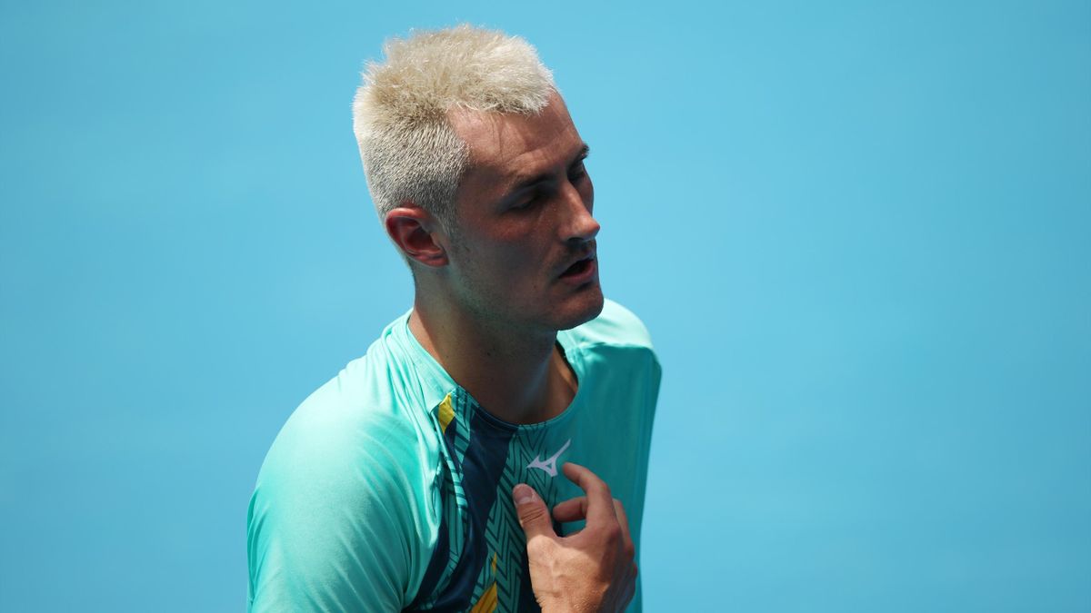 Bernard Tomic of Australia reacts in his match against Roman Safiullin of Russia during day two of 2022 Australian Open Qualifying at Melbourne Park on January 11, 2022 in Melbourne, Australia.