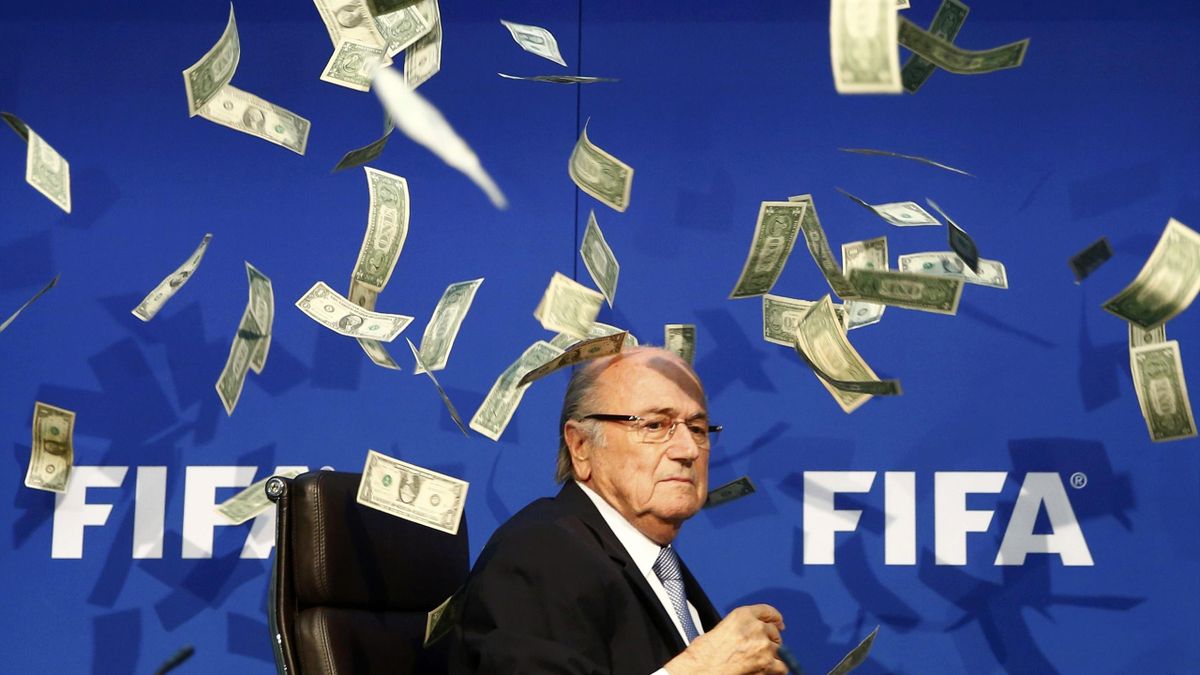 Best sporting pictures of 2015 - Banknotes are thrown at FIFA President Sepp Blatter as he arrives for a news conference after the Extraordinary FIFA Executive Committee Meeting at the FIFA headquarters in Zurich, Switzerland July 20, 2015. Days after win