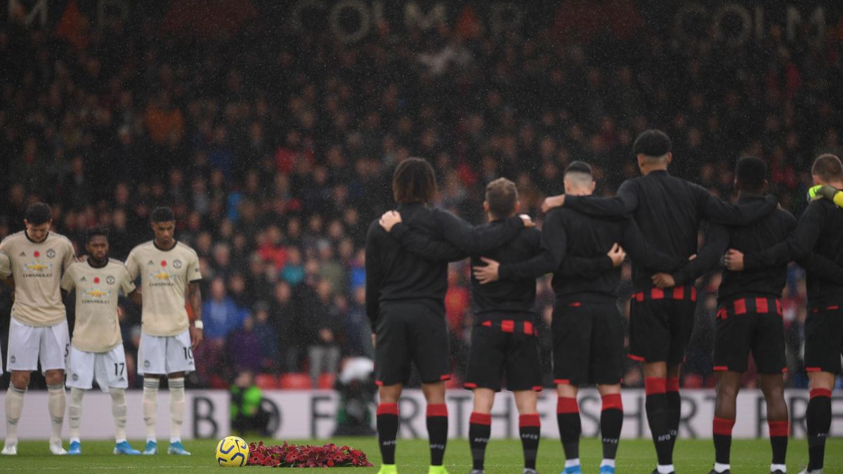 Floral wreaths are seen on the pitch as players and fans observe a minutes silence ahead of Remembrance Day prior to the Premier League match between AFC Bournemouth and Manchester United at Vitality Stadium on November 02, 2019 in Bournemouth, United Kin