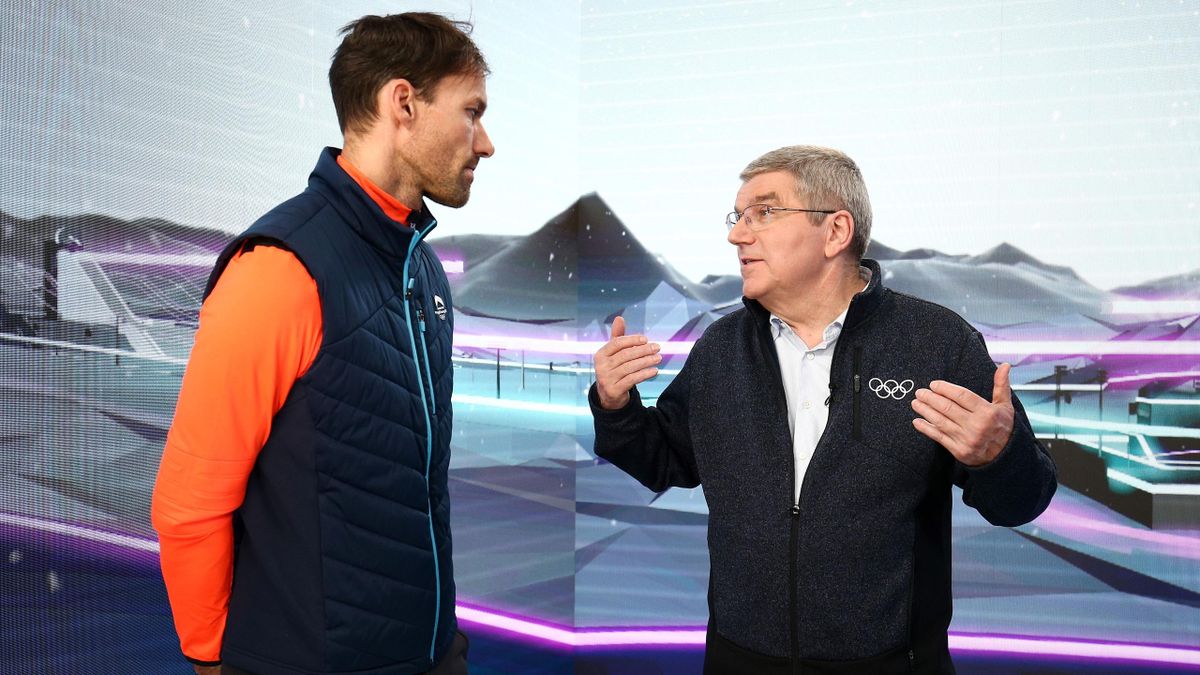 IOC President Thomas Bach talks to German Olympic gold medallist Sven Hannawald in the Eurosport Cube
