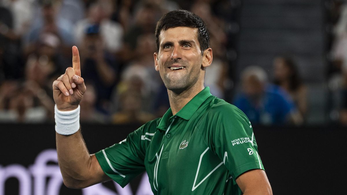 Novak Djokovic of Serbia celebrates his victory over Roger Federer of Switzerland in the semi-final of the men's singles on day eleven of the 2020 Australian Open at Melbourne Park on January 30, 2020 in Melbourne, Australia.