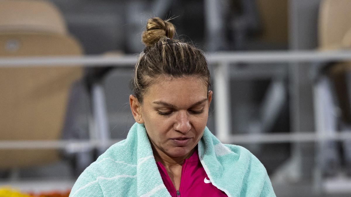 Simona Halep of Romania looks dejected at the change of ends during her match against Iga Swiatek of Poland in the fourth round of the women’s singles at Roland Garros on October 04, 2020 in Paris, France