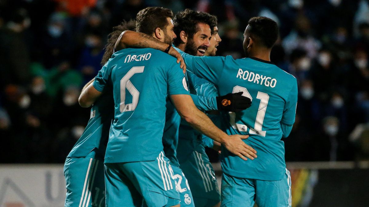 Real Madrid's Spanish midfielder Isco (C) celebrates with teammates after scoring a goal during the Spanish Copa del Rey (King's Cup) football match between Alcoyano and Real Madrid CF at the El Collao Stadium in Alcoy, on January 5, 2022.