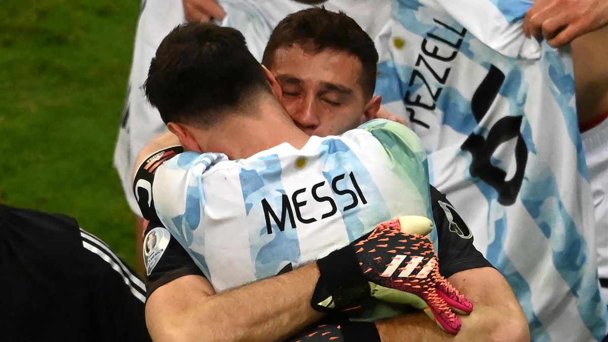 Argentina's goalkeeper Emiliano Martinez and Argentina's Lionel Messi celebrate at the end of the Conmebol 2021 Copa America