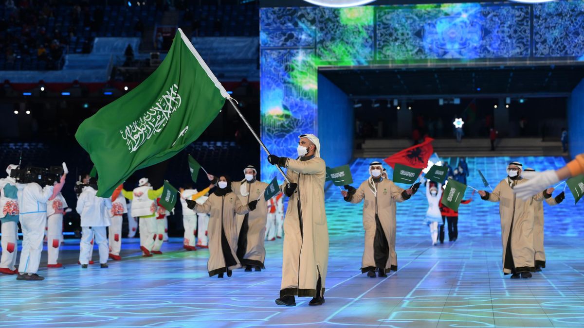 Flag bearer Fayik Abdi of Team Saudi Arabia carries their flag during the Opening Ceremony of the Beijing 2022 Winter Olympics at the Beijing National Stadium