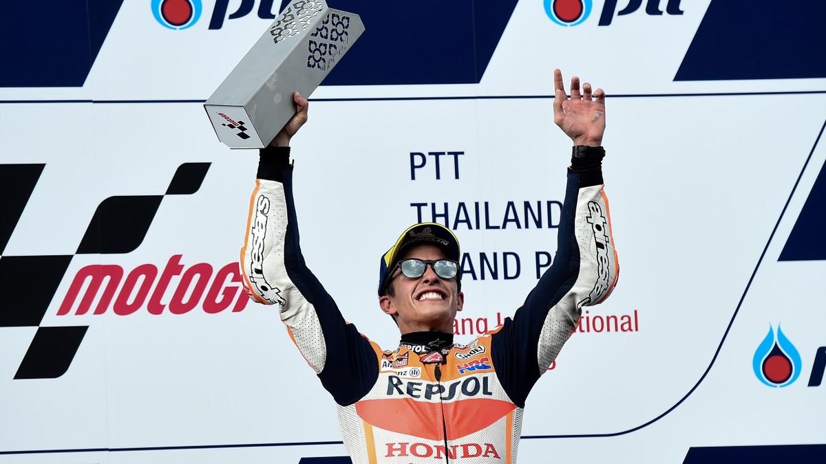Repsol Honda Team's Spanish rider Marc Marquez celebrates on the podium after winning the MotoGP race of the inaugural Thailand Grand Prix at Buriram International Circuit on October 7, 2018