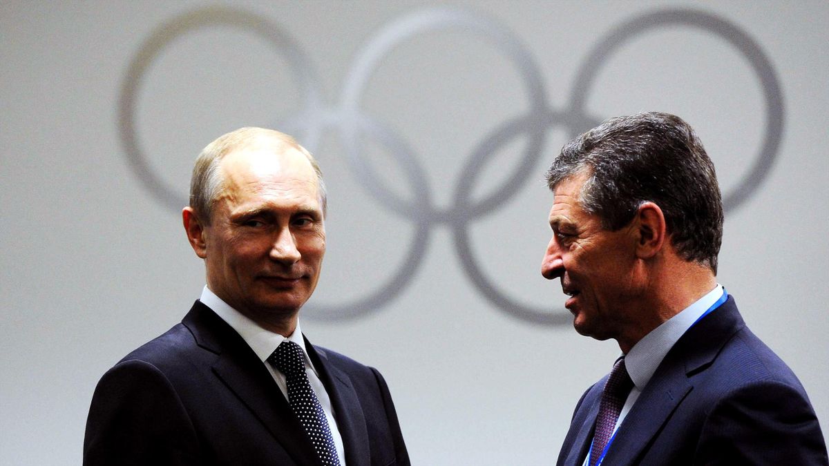 Russia s president Vladimir Putin (L), and first deputy prime minister, head of the Russian Olympic Committee, Alexander Zhukov, before the closing ceremony of the 22nd Winter Olympic Games in Sochi 2014