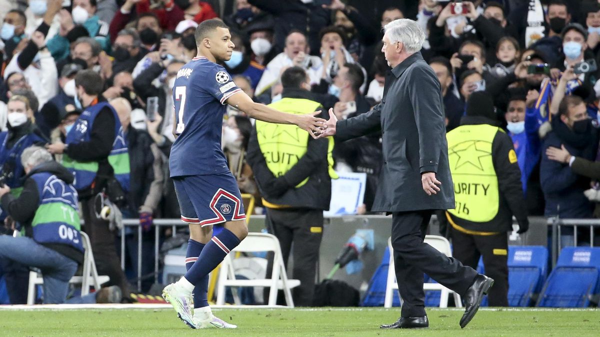 Kylian Mbappe of PSG salutes coach of Real Madrid Carlo Ancelotti following the UEFA Champions League Round Of Sixteen Leg Two match between Real Madrid and Paris Saint-Germain (PSG) at Estadio Santiago Bernabeu on March 9, 2022