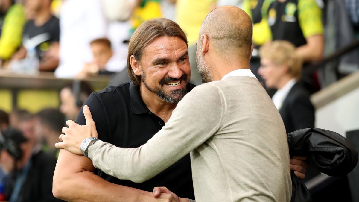 Daniel Farke, Manager of Norwich City greets Pep Guardiola, Manager of Manchester City prior to the Premier League match against Manchester City at Carrow Road on September 14, 2019