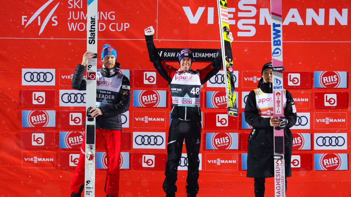 Second placed Norway's Robert Johansson, first placed Austria's Stefan Kraft and third placed Japan's Ryoyu Kobayashi celebrate on the podium after the FIS Men´s Ski Jumping World Cup in Lillehammer, Norway on March 12, 2019.