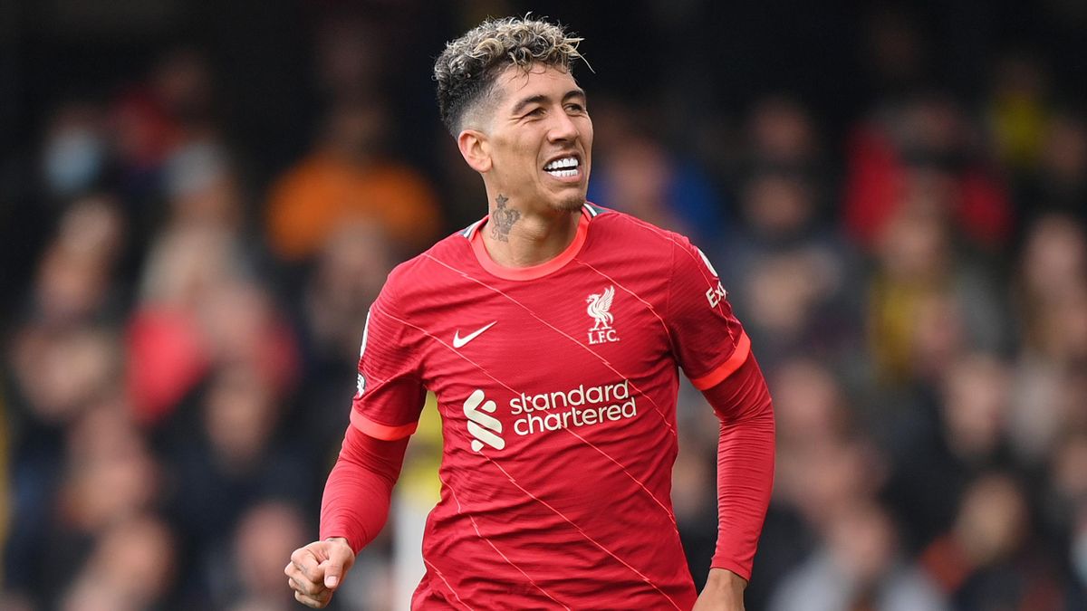 WATFORD, ENGLAND - OCTOBER 16: Roberto Firmino of Liverpool celebrates after scoring their side's third goal during the Premier League match between Watford and Liverpool at Vicarage Road on October 16, 2021 in Watford, England. (Photo by Justin Setterfie