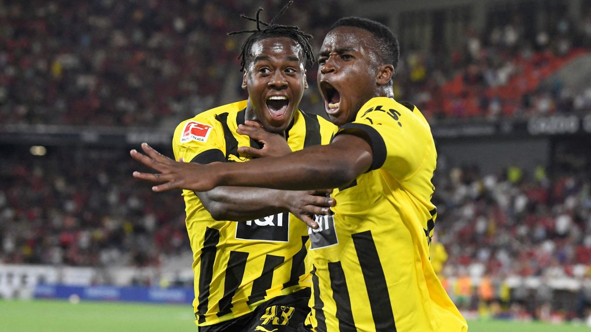 Jamie Bynoe-Gittens (L) and Youssoufa Moukoko (R) celebrate during the German first division Bundesliga match between SC Freiburg and Borussia Dortmund