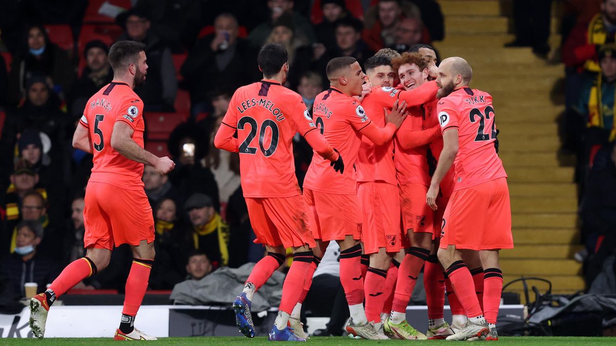 Josh Sargent of Norwich City celebrates with his team mates after scoring his side's first goal during the Premier League match between Watford and Norwich City at Vicarage Road on January 21, 2022