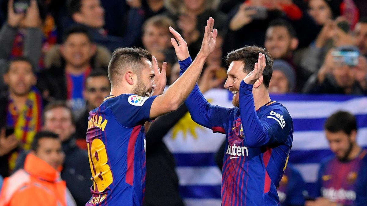 Barcelona's Argentinian forward Lionel Messi (R) celebrates with Barcelona's Spanish defender Jordi Alba after scoring his second goal during the Spanish Copa del Rey (King's Cup) round of 16 second leg football match FC Barcelona vs RC Celta de Vigo at t