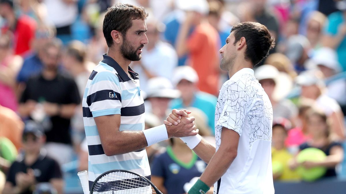 Marin Cilic of Croatia congratulates Novak Djokovic of Serbia during the Western & Southern Open at Lindner Family Tennis Center on August 18, 2018 in Mason, Ohio