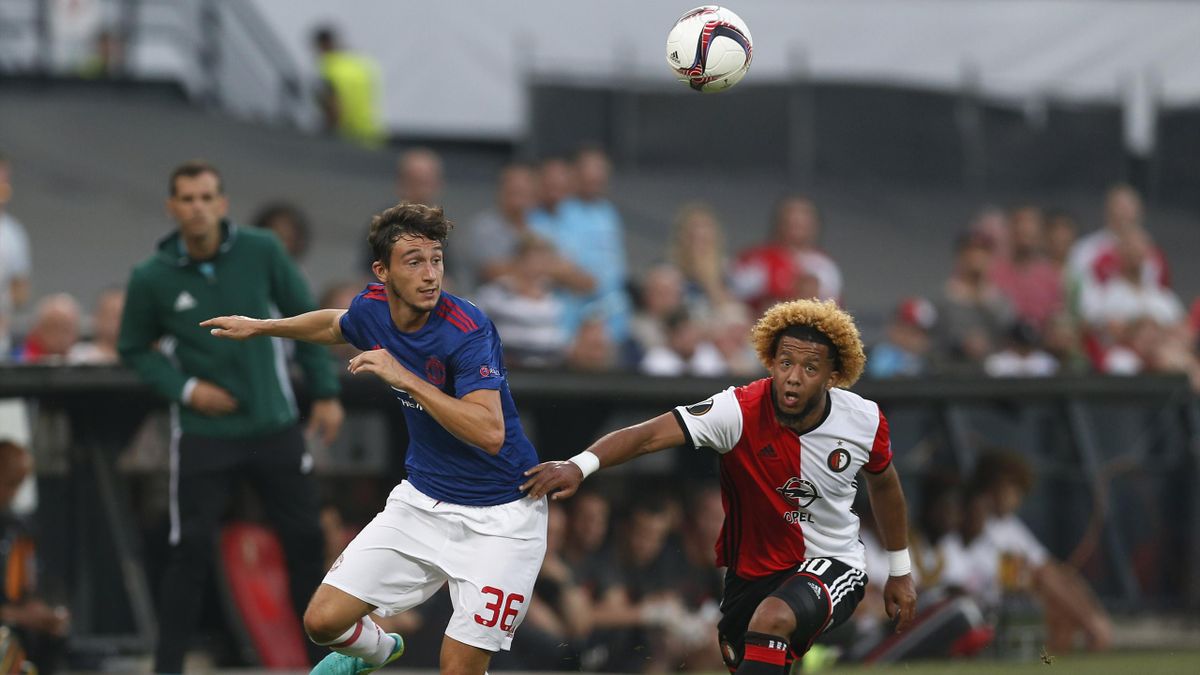 Manchester United's Matteo Darmian in action with Feyenoord's Tonny Vilhena