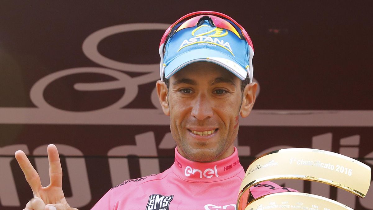 Italy's Vincenzo Nibali celebrates with the trophy on the podium after winning the 99th Giro d'Italia, Tour of Italy, after the 21th stage from Cuneo to Turin on May 29, 2016