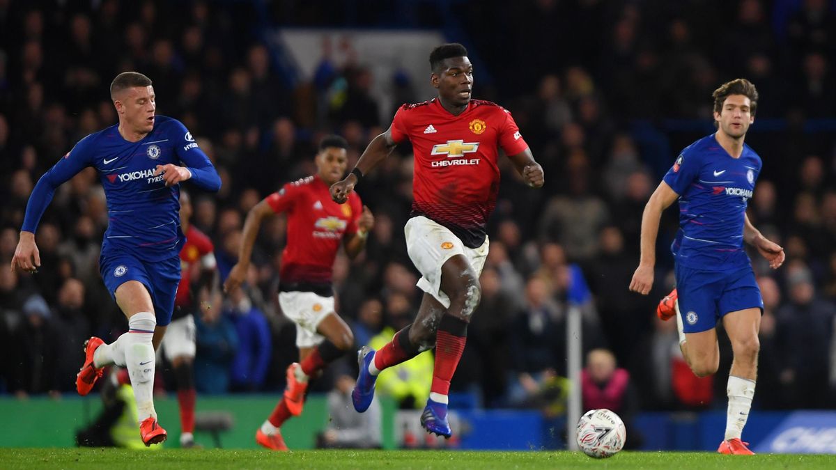 Paul Pogba of Manchester United is chased by Ross Barkley and Marcos Alonso of Chelsea during the FA Cup Fifth Round match between Chelsea and Manchester United at Stamford Bridge on February 18, 2019 in London, United Kingdom.