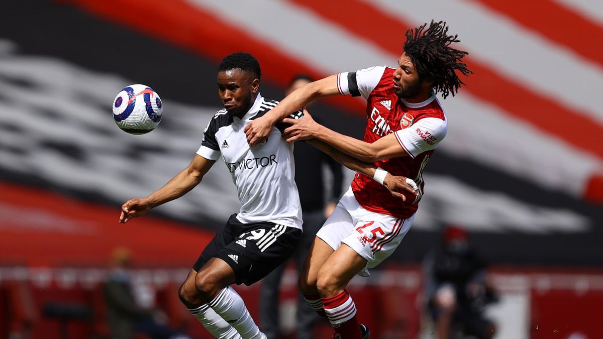 Ademola Lookman of Fulham and Mohamed Elneny of Arsenal battle for the ball during the Premier League match between Arsenal and Fulham at Emirates Stadium