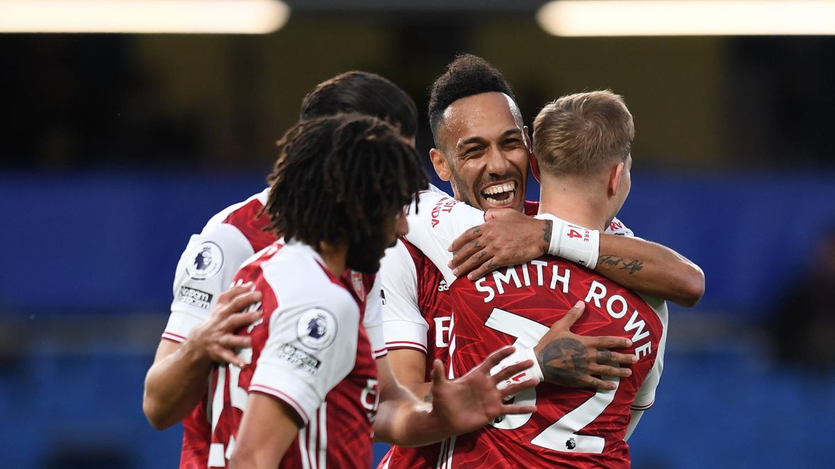 Emile Smith Rowe celebrates scoring a goal for Arsenal with Pierre-Emerick Aubameyang during the Premier League match between Chelsea and Arsenal at Stamford Bridge on May 12, 2021 in London, England.