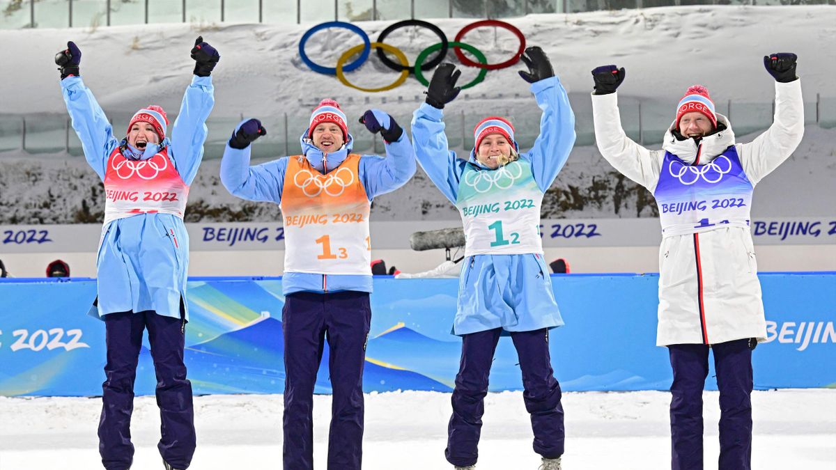 Norway's team (L-R) Marte Olsbu Roeiseland, Johannes Thingnes Boe, Tiril Eckhoff and Tarjei Boe celebrate their first place in the podium during the medal ceremony in the Biathlon Mixed Relay 4x6km (W+M) event o