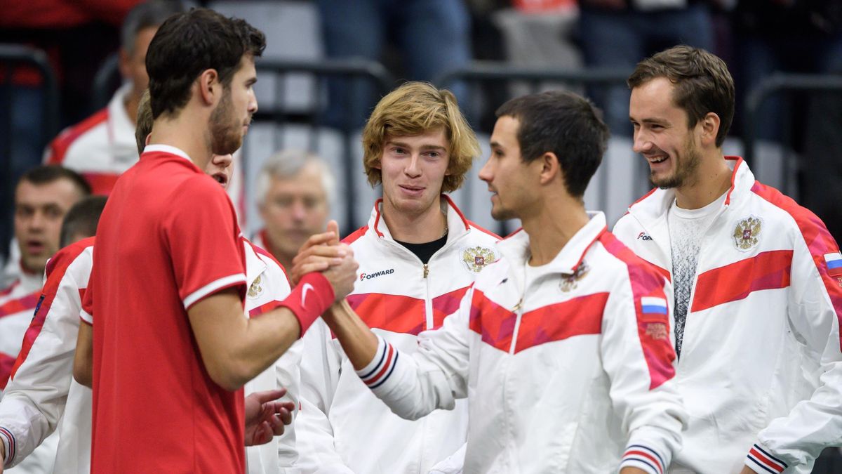 Russia's Karen Khachanov and teammates Andrey Rublev, Evgeny Donskoy and Daniil Medvedev react after Russia beat Switzerland in their Davis Cup tennis qualifier in Biel on February 2, 2019