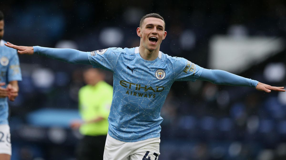Phil Foden of Manchester City celebrates after scoring his team's third goal during the Premier League match between Manchester City and Everton at Etihad Stadium on May 23, 2021 in Manchester, England.
