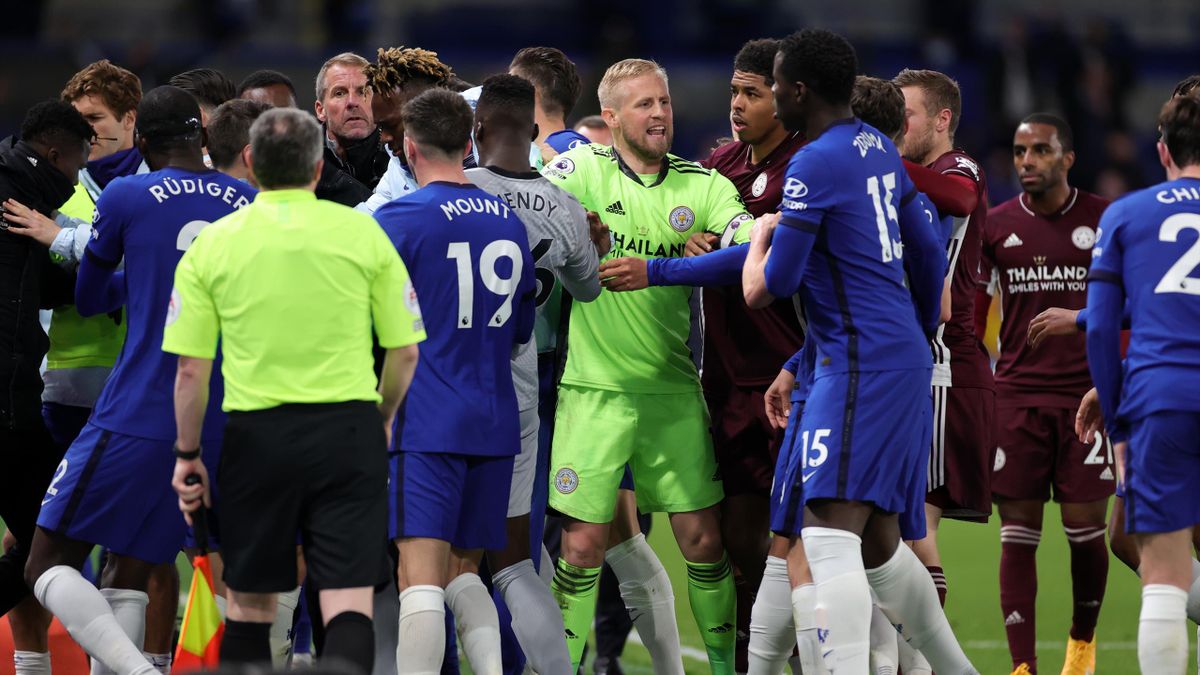 Kasper Schmeichel of Leicester City tries to calm things down during the Premier League match between Chelsea and Leicester City at Stamford Bridge on May 18, 2021 in London, United Kingdom.