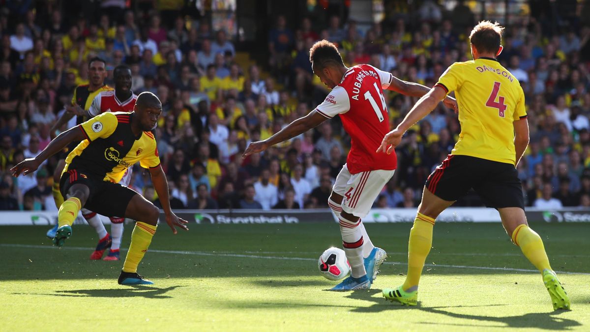 Pierre-Emerick Aubameyang of Arsenal (14) scores his team's first goal during the Premier League match between Watford FC and Arsenal FC at Vicarage Road on September 15, 2019