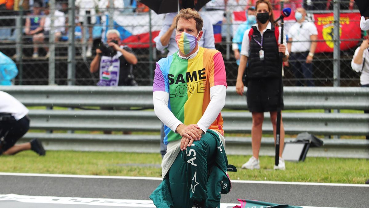 Sebastian Vettel of Germany and Aston Martin F1 Team takes a knee on the grid as part of the We Race As One gesture before the F1 Grand Prix of Hungary at Hungaroring on August 01, 2021 in Budapest, Hungary.