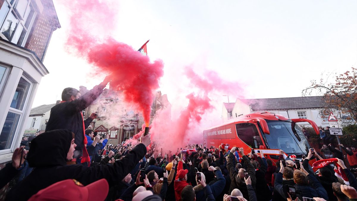 Liverpool fans let of smoke flares as their team coach arrives at the stadium prior to the Premier League match between Liverpool FC and Manchester City at Anfield on November 10, 2019 in Liverpool, United Kingdom