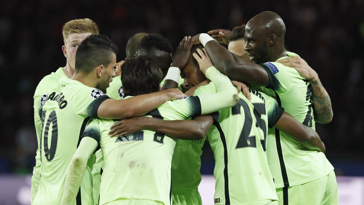 Fernandinho celebrates with team mates after scoring the second goal for Manchester City